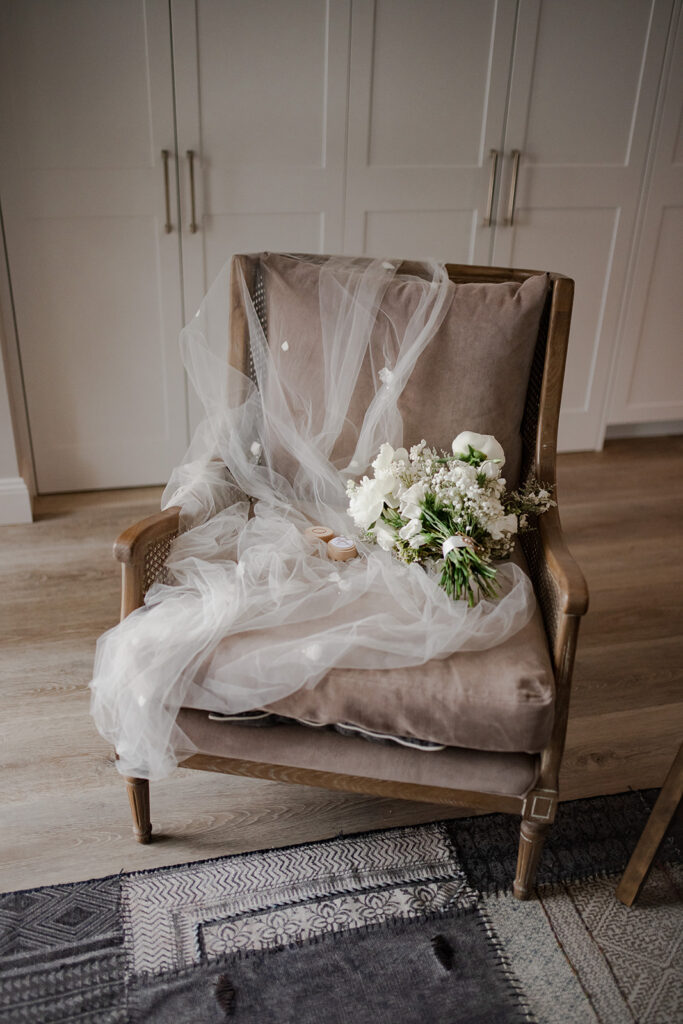 Soft pastel bridal bouquet styled with white veil for a romantic country wedding in NSW